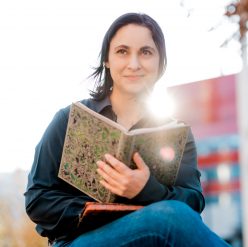 photo of Veronica Badea, outdoors, reading