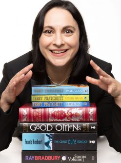 photo of Veronica Badea with stack of favourite books