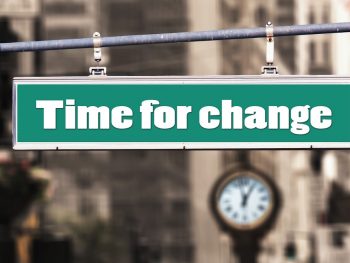 Street sign saying 'Time for change'